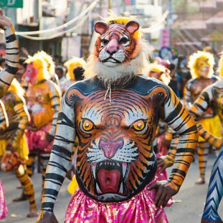 Thrissur, Kerala, India - September 19, 2013: Pulikali Dancers (Tiger Dance) performers waiting for thier turn with full makeup during Onam festival celebration at Thrissur,Kerala.