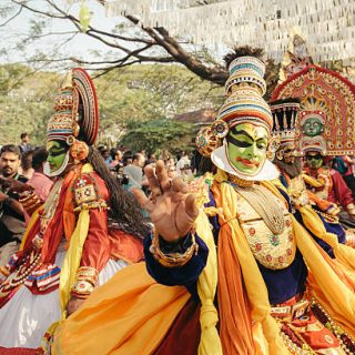 Kochi, India - January 1, 2016:  Traditional Kathakali dance on New Year carnival in Fort Kochi (Cochin), Kerala, India. Kochi, formerly known as Cochin, is a city and port in the Indian state of Kerala. One of the famous events here is Cochin New Year Carnival, since 1984 at Fort Kochi. It is celebrated at Fort Kochi every year during the last ten days of December. There are massive procession of caparisoned elephants, games and partying.